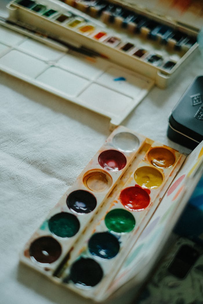 Vibrant watercolor palette with assorted colors, perfect for creative art projects.
